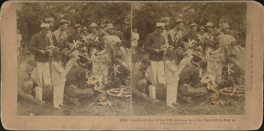 Grave of one of the 20th Kansas Boys on Decoration Day at Paco Cemetery, P. I.